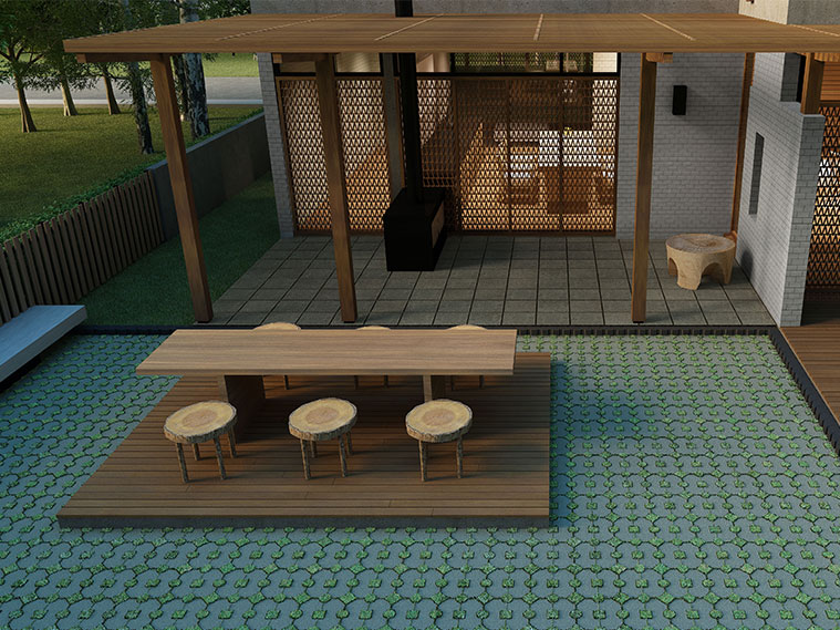 มุมนั่งเล่นหลังบ้านแสนสบายตาด้วยพื้นบล็อกหญ้าโทนเขียว